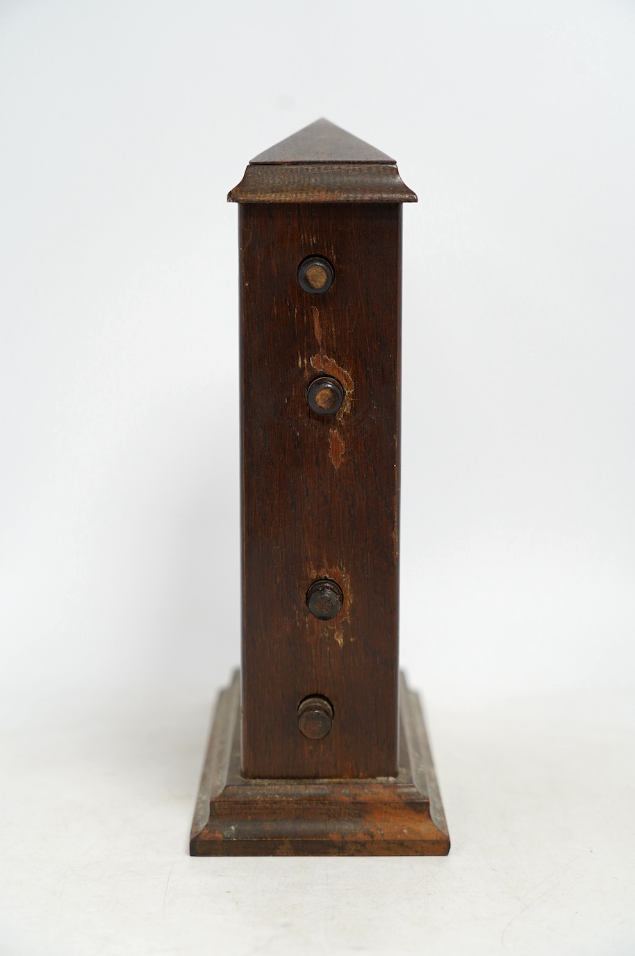An early 20th century oak perpetual calendar, 19cm wide, 26cm high. Condition - fair